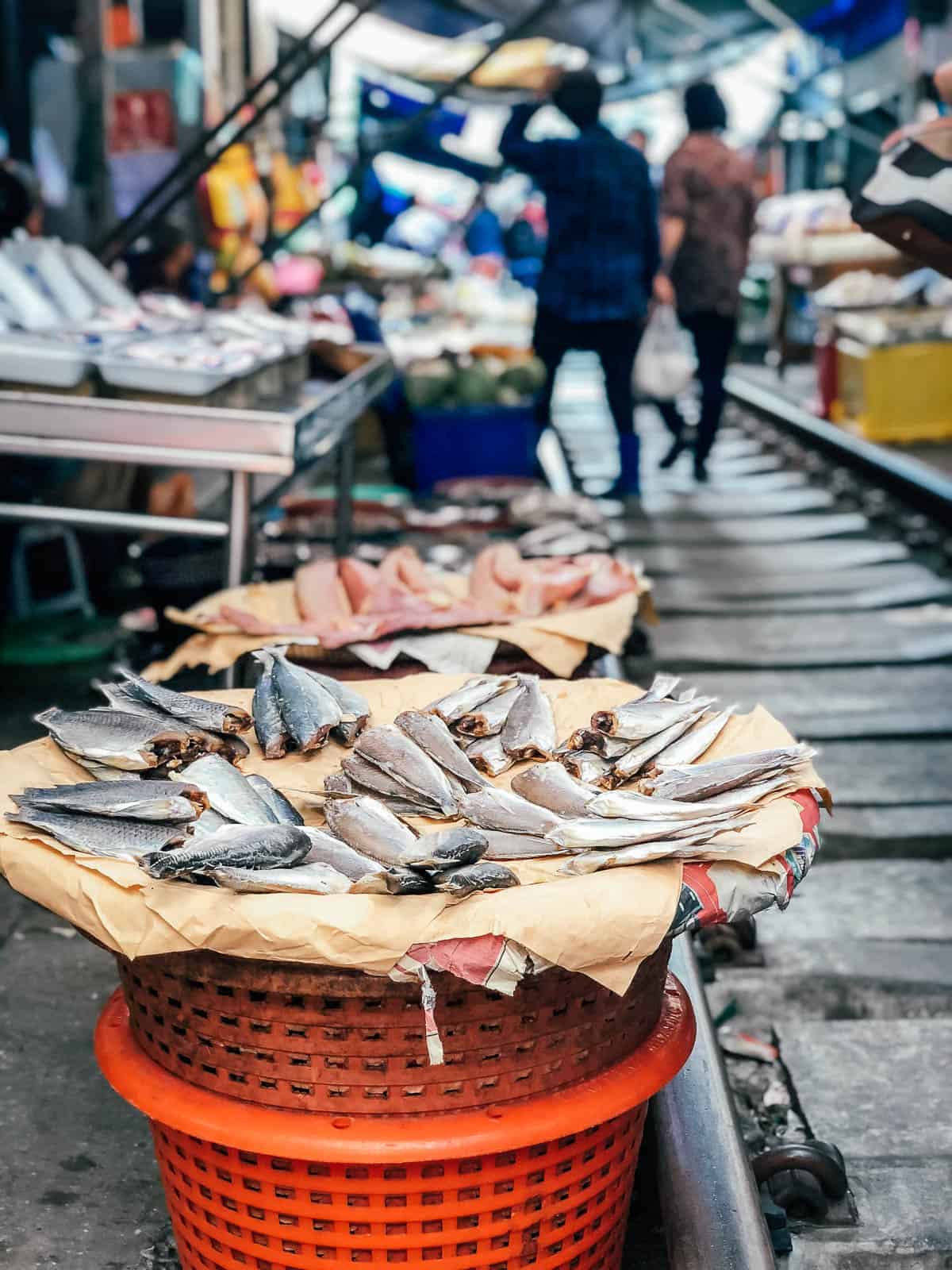 Raw fish for sale at Meeklong train market in Bangkok