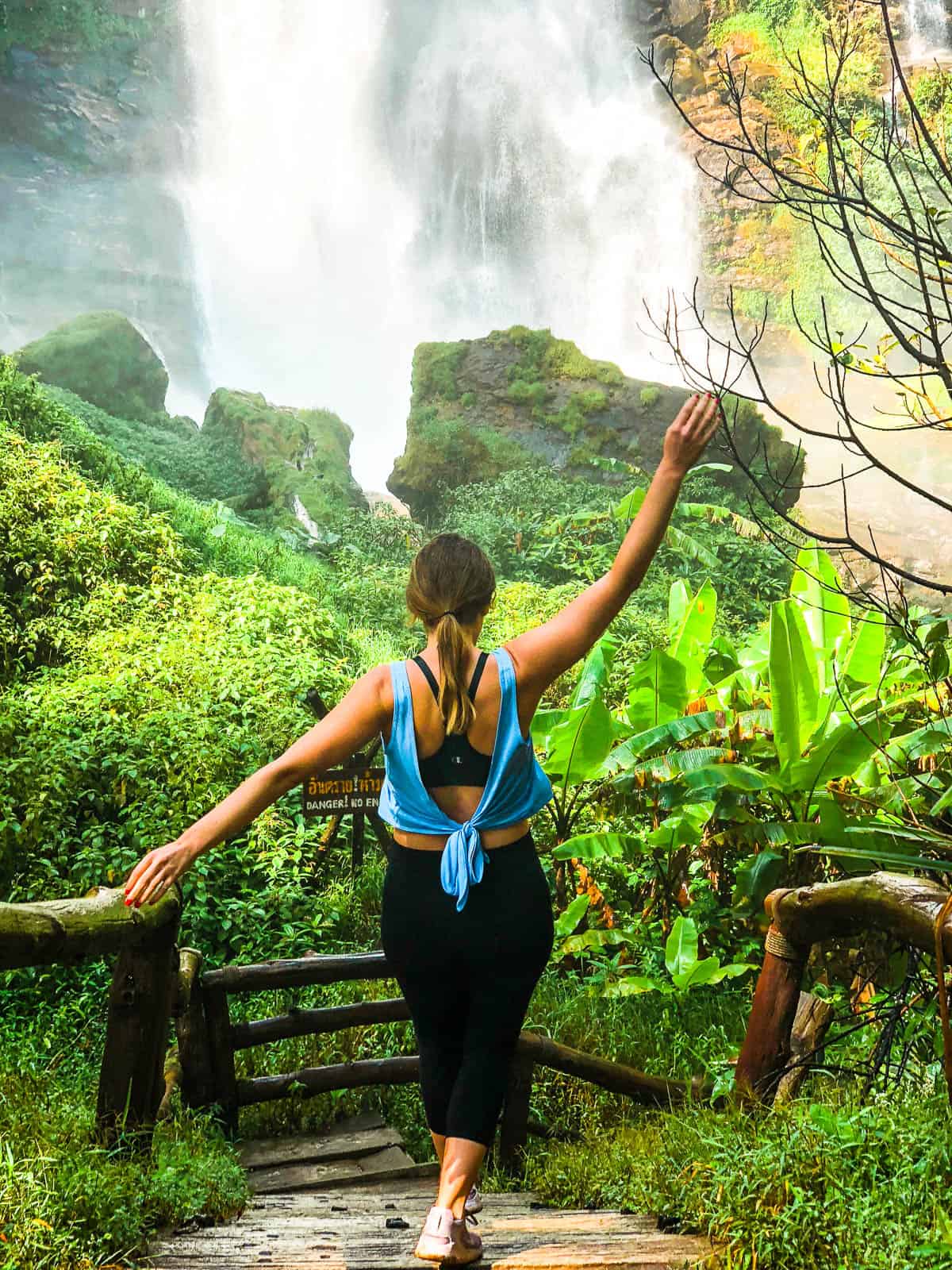 Walking down the steps to a waterfall at Doi Inthanon National Park in Chiang Mai during a 4-day itinerary