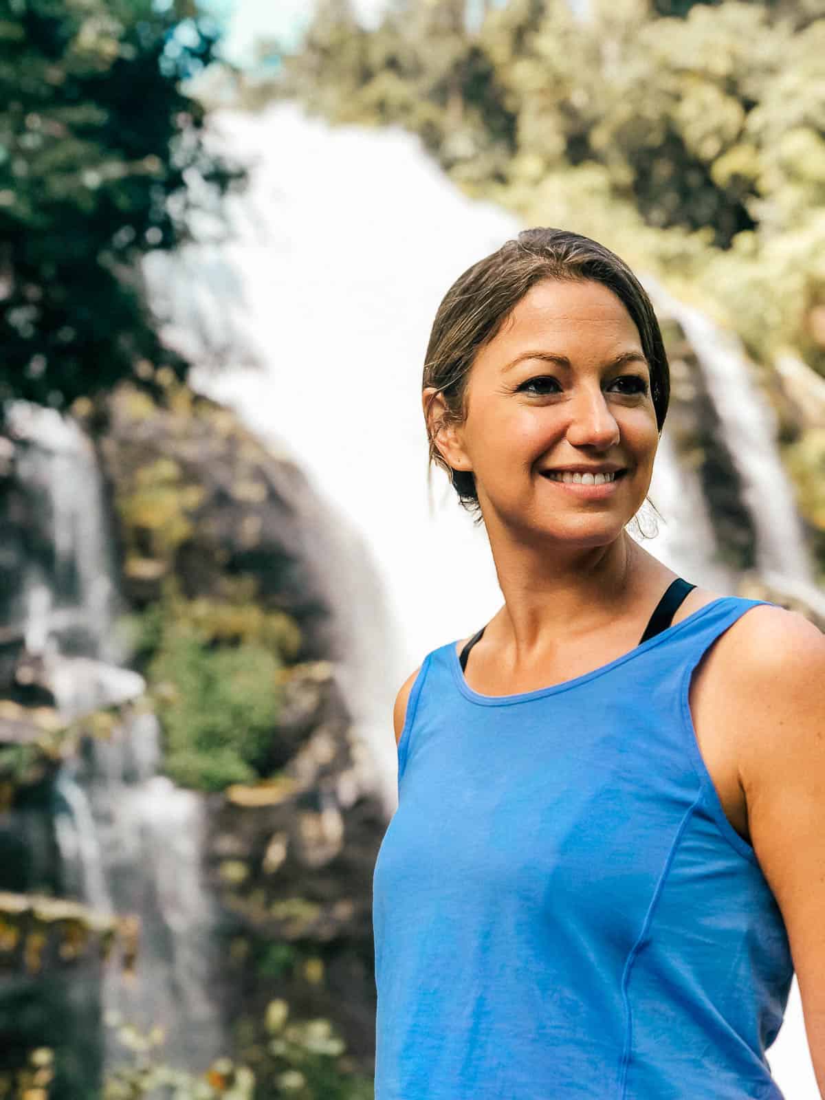 Standing in front of a waterfall at Chiang Mai's Doi Inthanon National Park