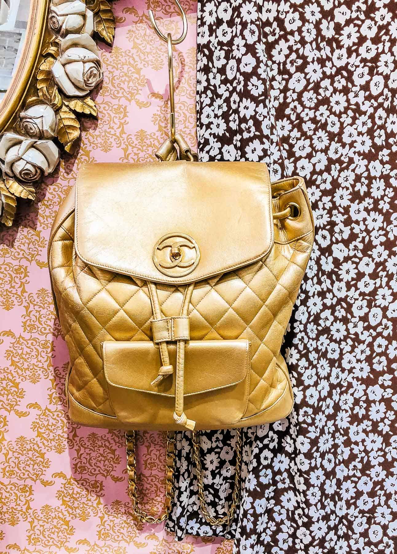 Gold Chanel backpack at Vintage Qoo luxury resale store in Tokyo 