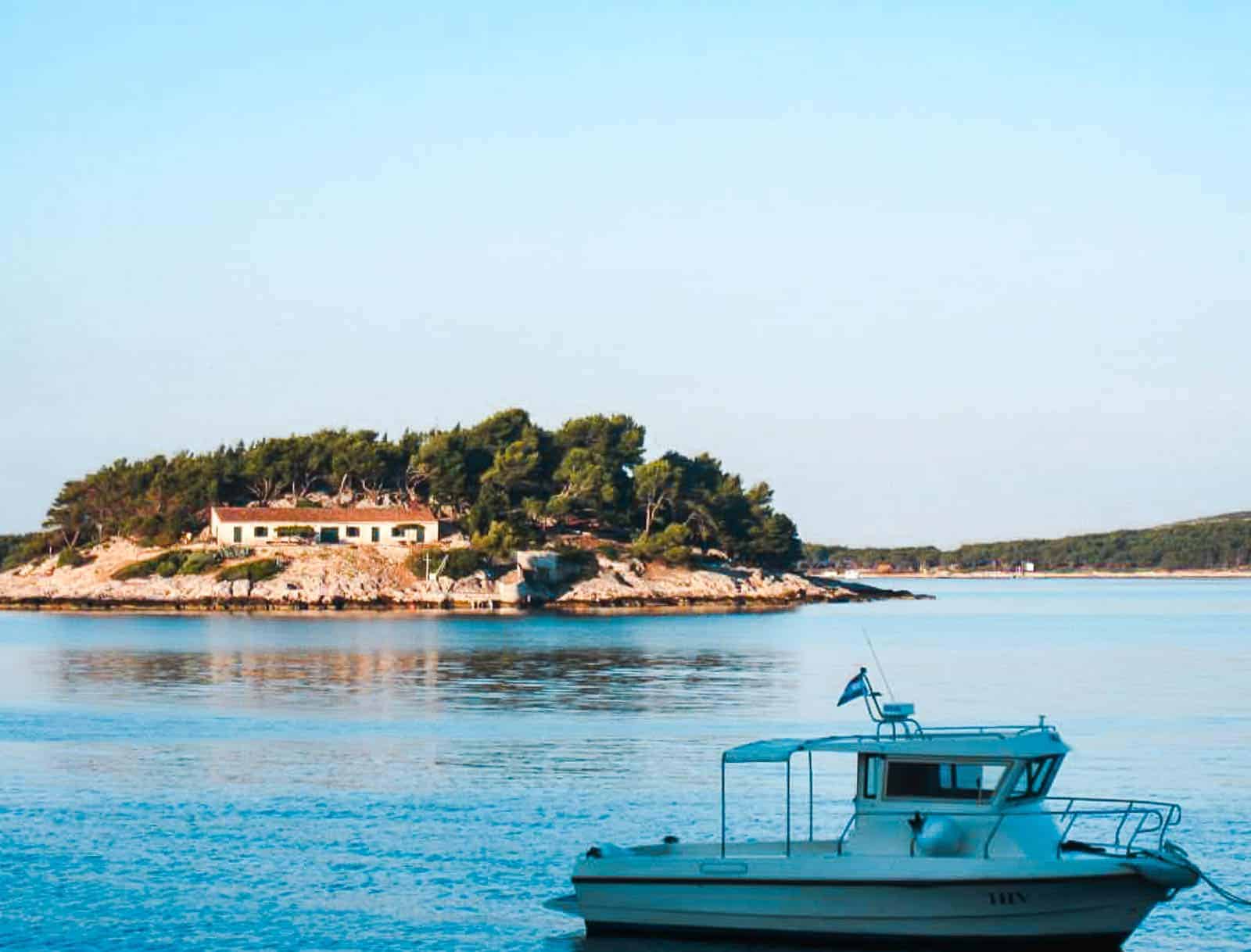 A boat cruising past Hvar Island in Croatia