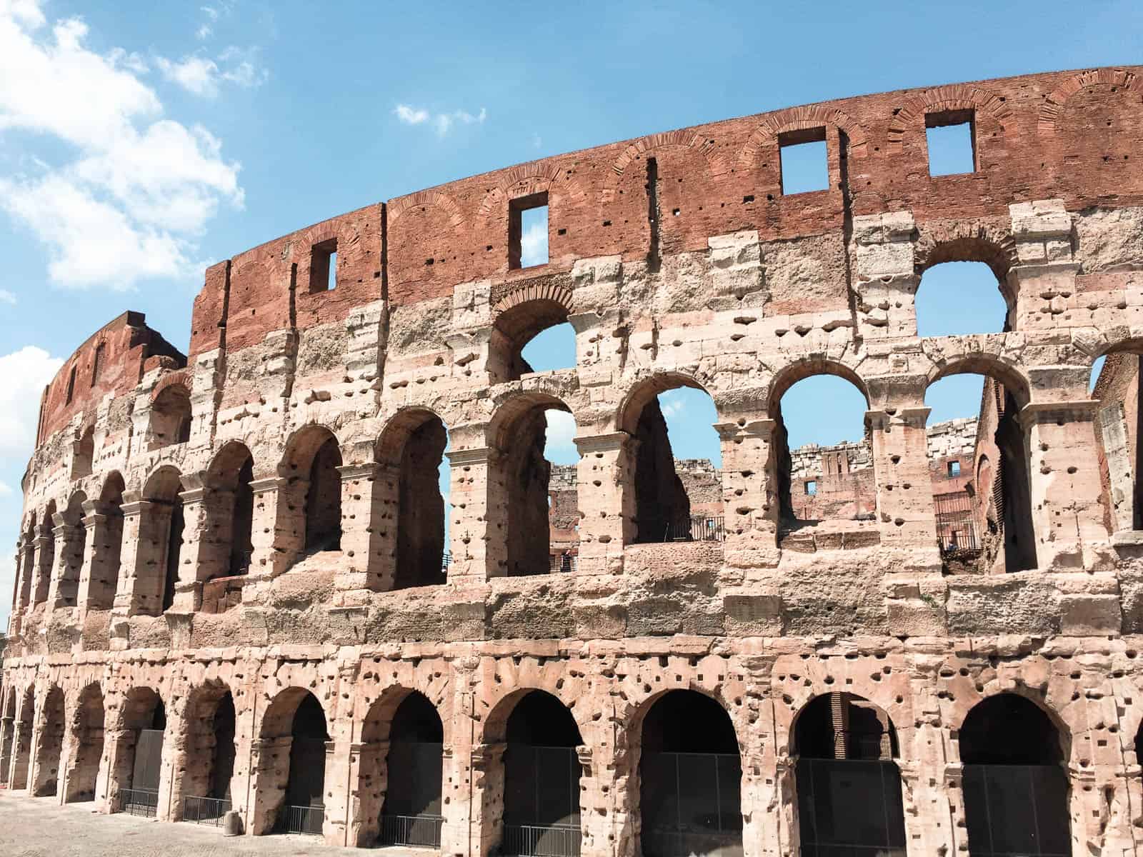 Side view of the exterior of the colosseum in rome during a 4 day rome itinerary