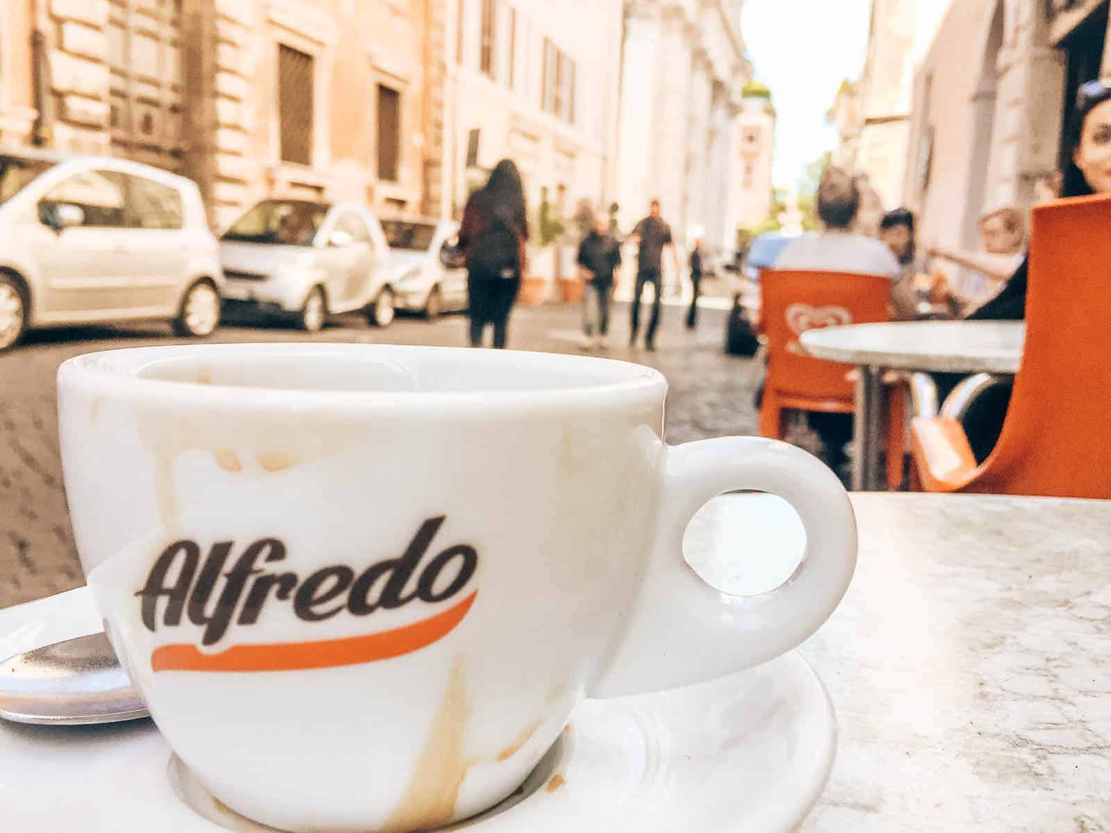 Cup of espresso on a table outside at a cafe in Rome