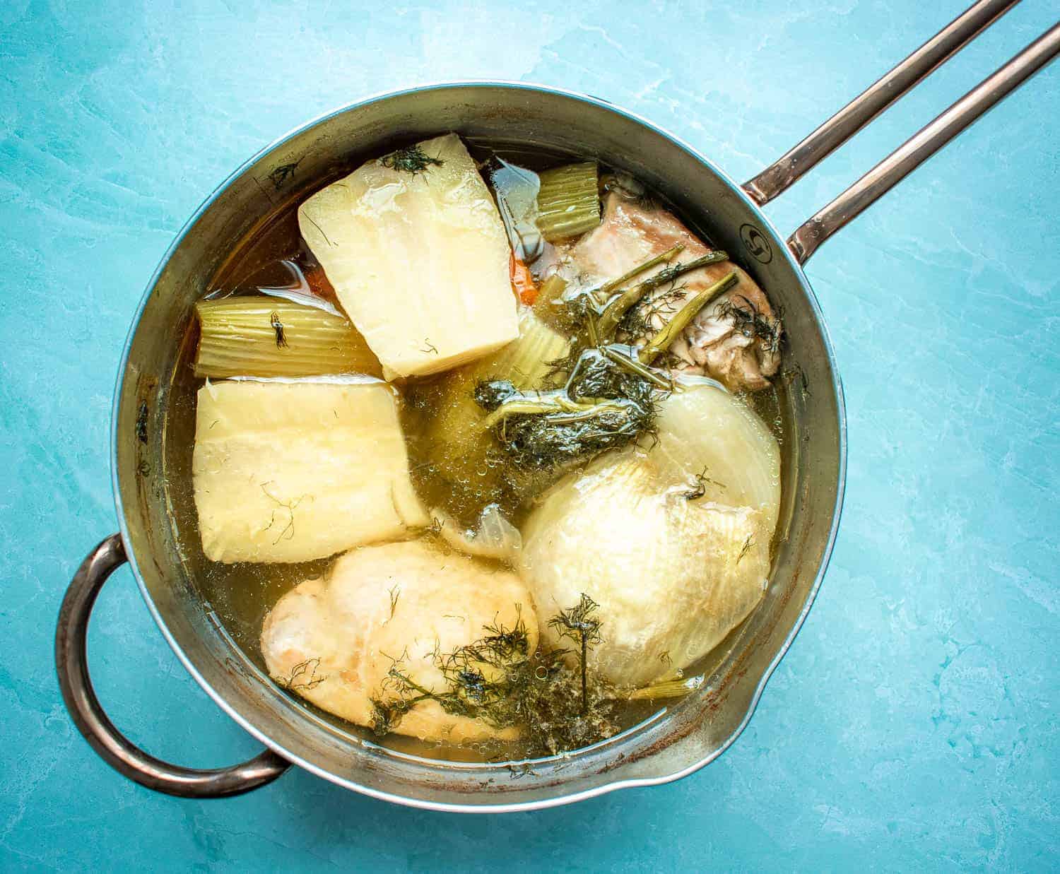 Pot of homemade chicken soup stock 