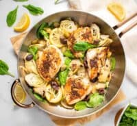 Easy, flavorful one pan dinner pot filled with chicken, olives, artichokes and lemon