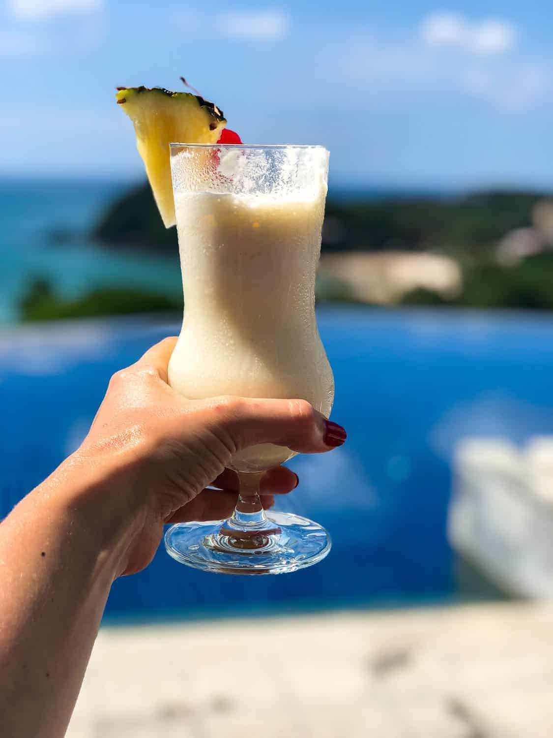 Pina Colada at the pool of the Pimalai Hotel and Spa in Koh Lanta Thailand