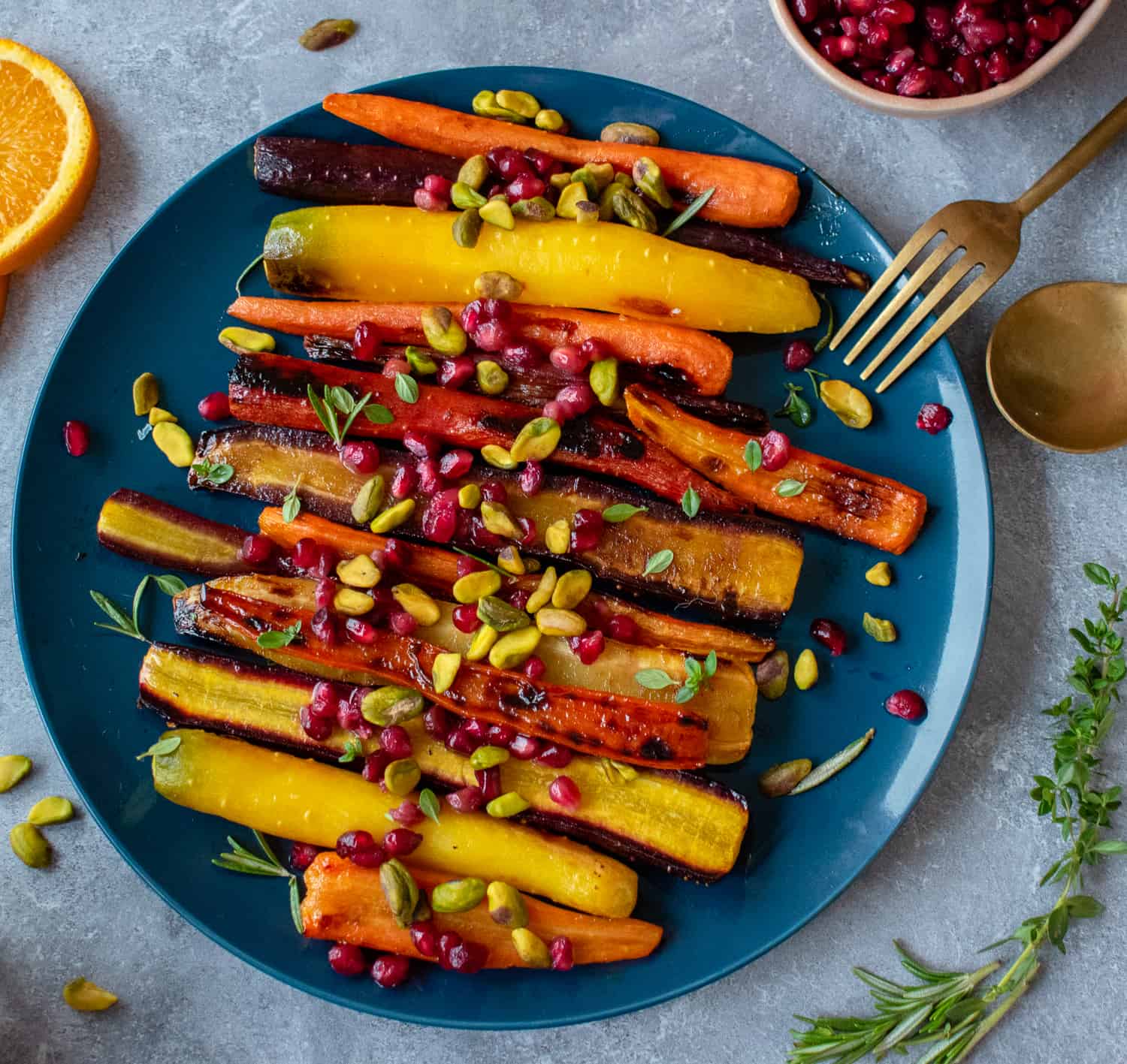 Try this easy, healthy and delicious side dish recipe of roasted rainbow heirloom carrots with orange-honey glaze, pomegranate seeds and pistachios.