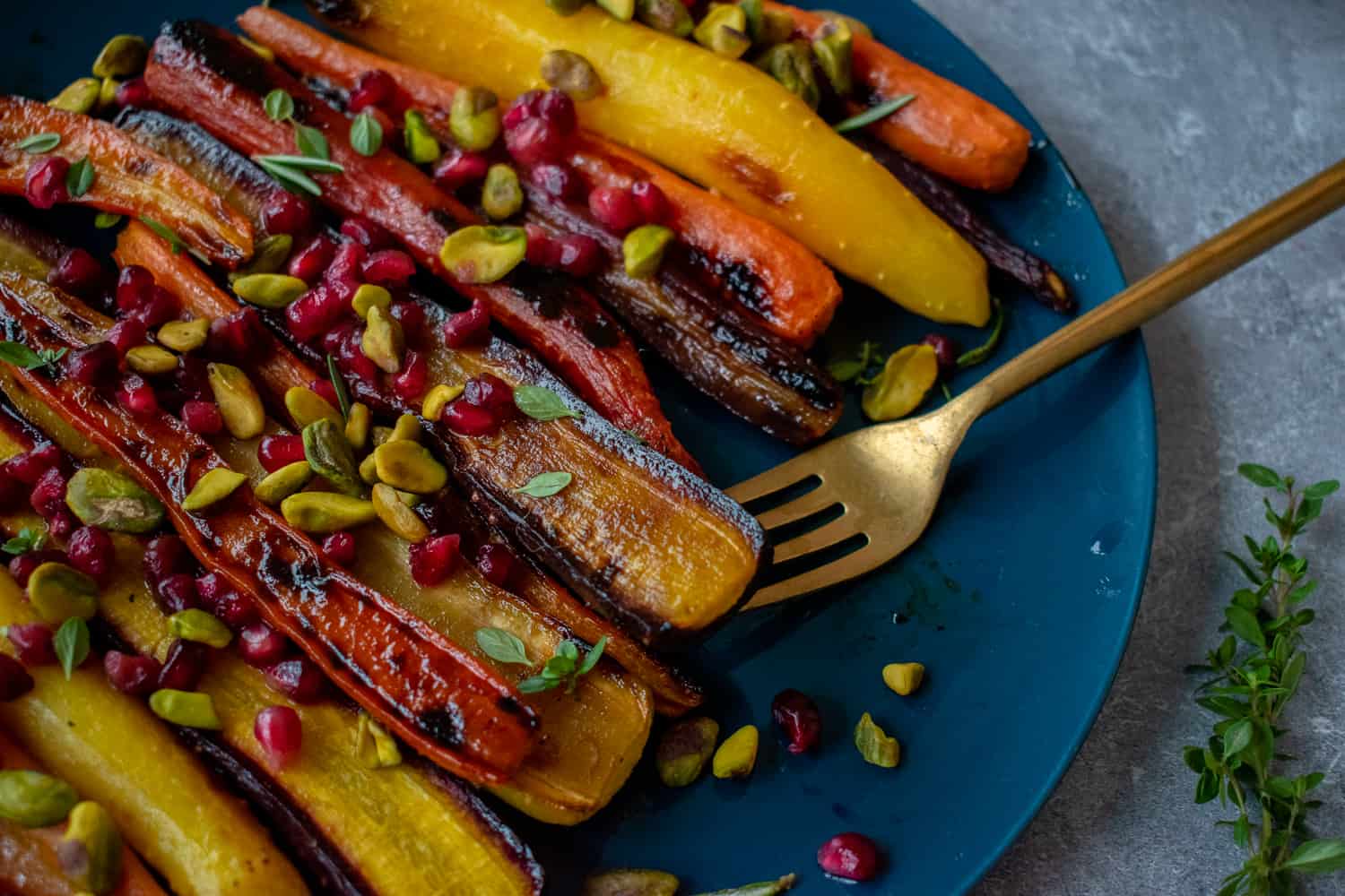 Try this easy, healthy and delicious side dish recipe of roasted rainbow heirloom carrots with orange-honey glaze, pomegranate seeds and pistachios.