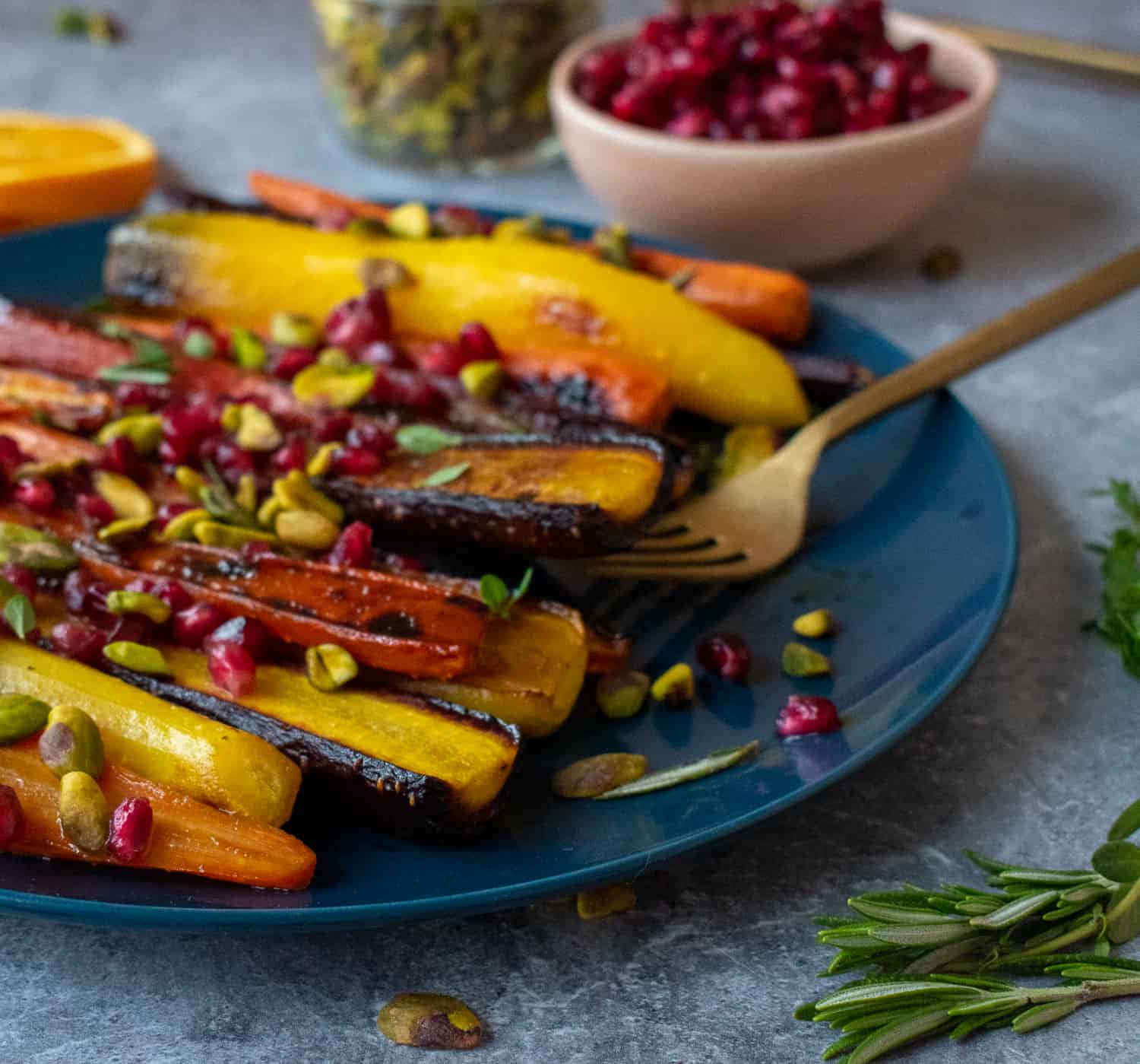 Try this easy, healthy and delicious side dish recipe of roasted rainbow heirloom carrots with orange-honey glaze, pomegranate seeds and pistachios.