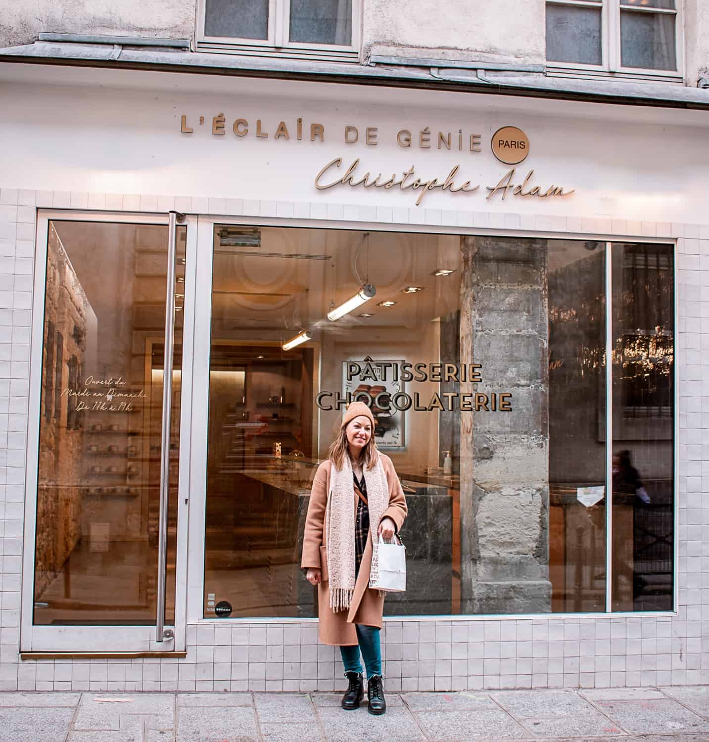 A woman outside Eclair de Genie in Paris