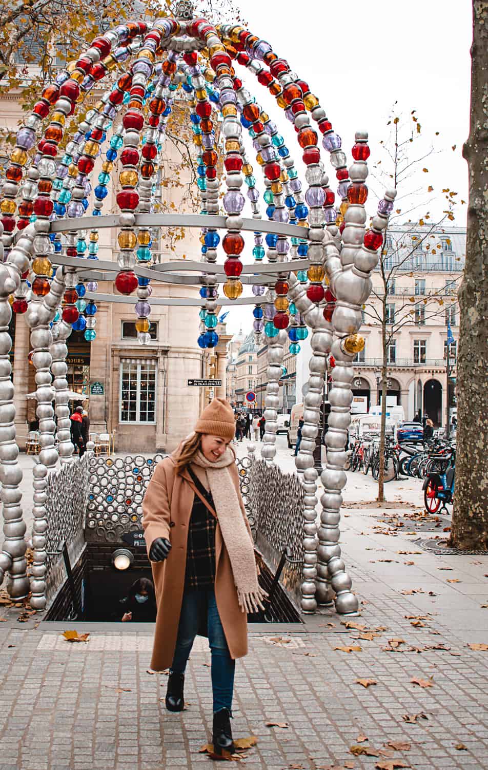 A woman coming out of the metro in Paris