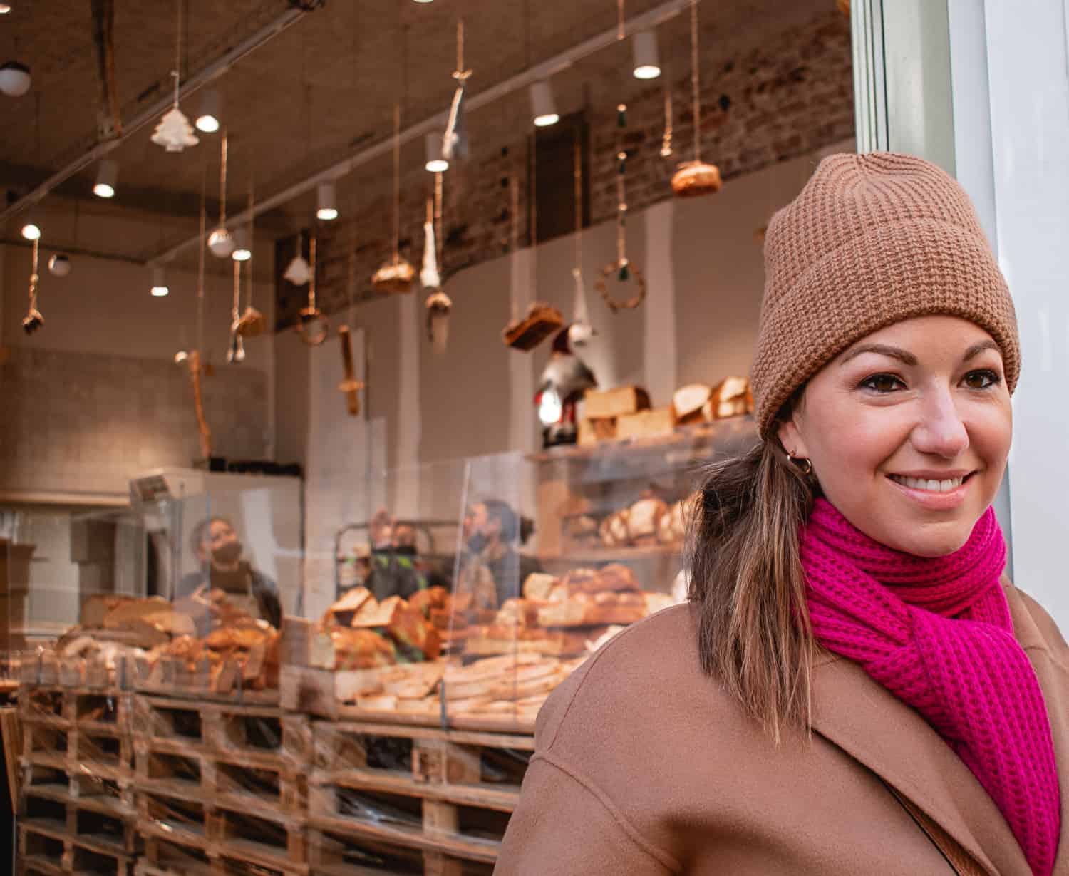 A woman outside a bakery in Paris