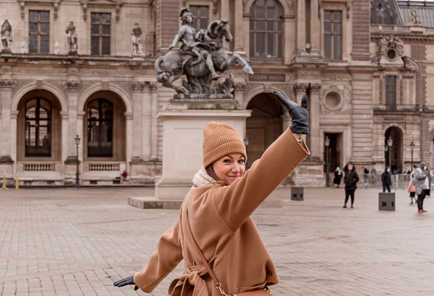 A woman outside the Louvre in Paris